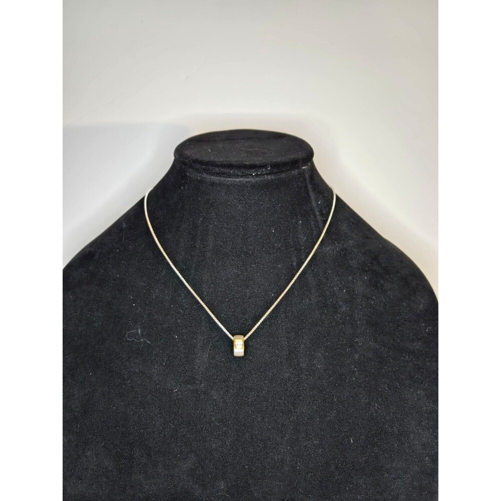 Silver Tone Necklace with Circular Pendant and Clear Rhinestone